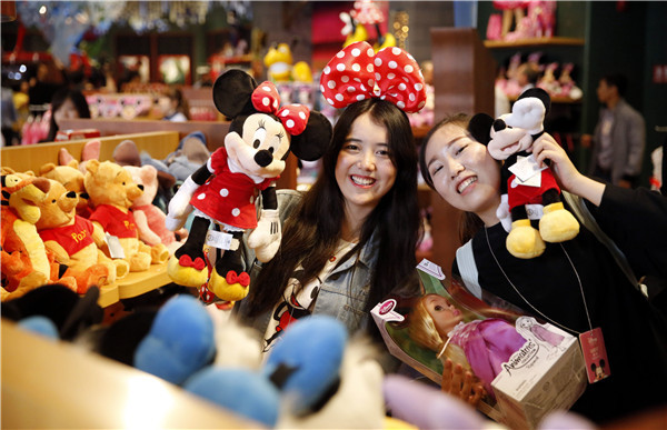 Two shoppers at the flagship Disney store in Shanghai, which opened last May.CHINA DAILY