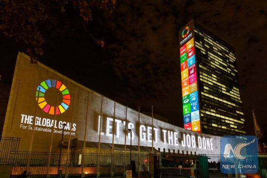 Massive projections on Sustainable Development Goals are seen on the north facade of the Secretariat building, and west facade of the General Assembly building at the United Nations headquarters in New York, the United States, Sept. 22, 2015. (Photo: Xinhua/file photo)