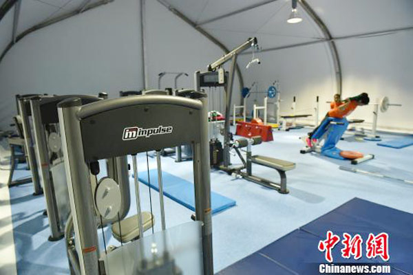 Athletes use equipment made by Chinese maker Impulse Group for a warm-up in training before a competition in Inchon, South Korea, Oct 3, 2014. (Photo/Chinanews.com)