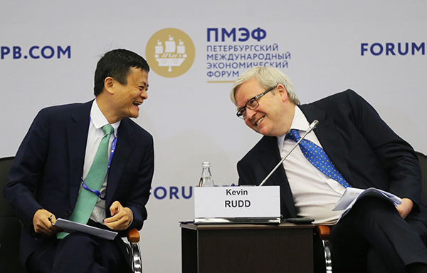 Jack Ma, chairman of Alibaba Group, talks with Kevin Michael Rudd, president of the Asia Society Policy Institute and former prime minister of Australia, at the St Petersburg International Economic Forum that opened on June 16, 2016. (Xu Jingxing/China Daily)