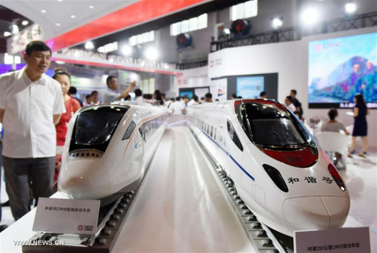 Visitor view models of high-speed train at the exhibition Modern Railways 2016 in Beijing, capital of China, June 20, 2016. Visitor view models of high-speed train at the exhibition Modern Railways 2016 in Beijing, capital of China, June 20, 2016. Visitor view models of high-speed train at the exhibition Modern Railways 2016 in Beijing, capital of China, June 20, 2016. (Photo: Xinhua/Chen Yehua)