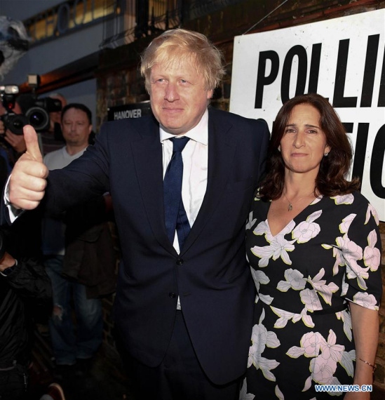 The Former Mayor of London Boris Johnson (L) and his wife Marina vote for the EU Referendum in central London, Britain, on June 23, 2016. (Xinhua/Str)