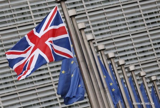 Photo taken on Jan. 29, 2016 shows the UK and EU flags outside the European Commission headquarters in Brussels, Belgium. (Xinhua/Ye Pingfan)