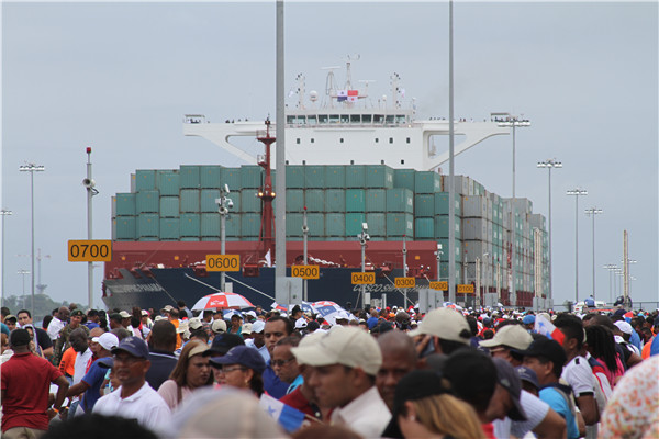 COSCO Shipping Panama becomes the first ship to make transit across the newly expanded Panama Canal, entering the Atlantic side locks after 8am on Sunday. The Panama Canal expansion is a 9-year, $5.4 billion project that can accommodate longer, larger-capacity ships. AMY HE / CHINA DAILY