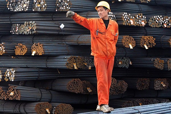 A worker at a steel depot in Qingdao Port, Shandong province. (Photo provided to China Daily)