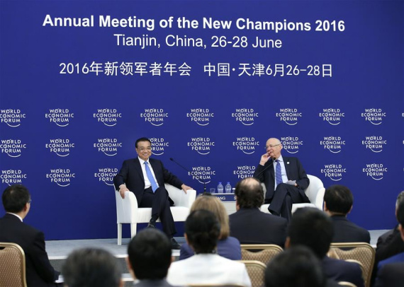 Chinese Premier Li Keqiang (L, rear) holds talks with business executives attending the Annual Meeting of the New Champions 2016, or the Summer Davos Forum, in Tianjin, north China, June 28, 2016. (Photo: Xinhua/Pang Xinglei)