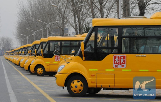 Photo taken on March 6, 2012 shows school buses produced by Zhengzhou Yutong Bus Co., Ltd. in Zhengzhou, capital of central China's Henan Province. (Xinhua/Zhu Xiang)