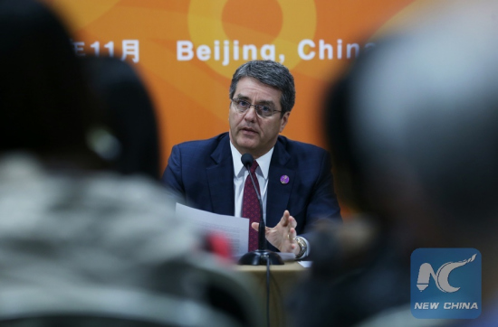 Roberto Azevedo, the Director-General of World Trade Organization (WTO) holds a press conference on the 26th APEC Ministerial Meeting at the China National Convention Center in Beijing, China, Nov. 8, 2014. (Xinhua/Wang Shen)