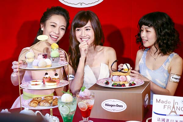 Models display Haagen-Dazs products at a news conference in Taipei.(Provided to China Daily)