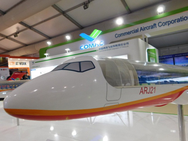 Commercial Aircraft Corporation of China, or Comac, displays a model of its ARJ21 passenger aircraft at the Farnborough International Airshow in Britain, July 12, 2016. (Photo by Angus McNeice/China Daily)