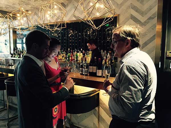 Tim Hutchinson (right) in Beijing for a dinner and winetasting event.(Photo provided to China Daily)