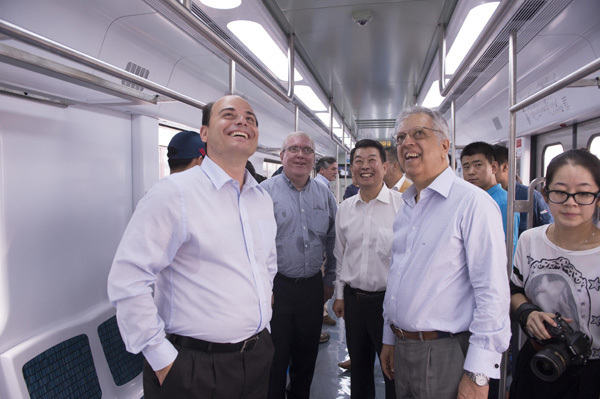 Brazilian transport officials inspect an electric multiple unit made by CRRC Changchun Railway. CRRC Changchun has provided 100 EMUs to Rio de Janeiro's rail systems. PROVIDED TO CHINA DAILY