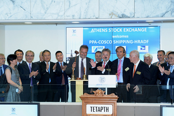 Executives of Chinese shipping behemoth Cosco Shipping Co. Ltd ring the bell for the formal start of trading on the Athens Stock Exchange after signing the agreement that made Cosco the 51 percent owner of Greece's biggest harbor in Athens, Greece, Aug 10 2016. (Photo/Provided to China Daily)