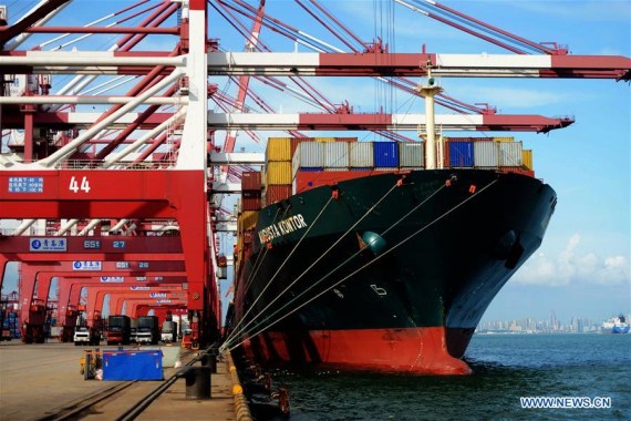 A cargo ship is seen anchored at Qingdao port in Qingdao, east China's Shandong Province, Aug. 8, 2016. China's exports in yuan-denominated terms rose 2.9 percent year on year in July, an improvement from June's 1.3-percent increase. (Photo: Xinhua/Yu Fangping)