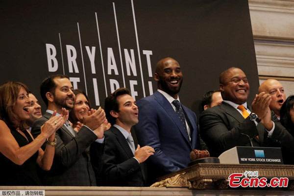 Bryant Stibel Co-Founders and General Partners Kobe Bryant and Jeff Stibel ring the opening bell at the New York Stock Exchange on Wall Street in New York City, Aug. 22, 2016. (Photo/Agencies)