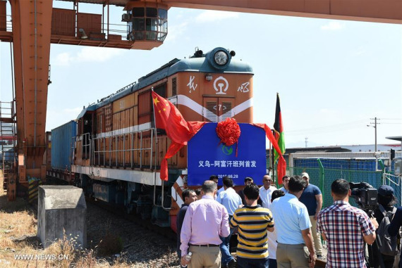 People attend the launching ceremony of the first freight train from Yiwu to Afghanistan in Yiwu, east China's Zhejiang Province, Aug. 28, 2016.  (Photo: Xinhua/Gong Xianming)