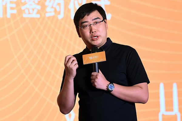 Cheng Wei, CEO of Didi Chuxing, at a news conference on Wednesday in Beijing. (Photo/China Daily)