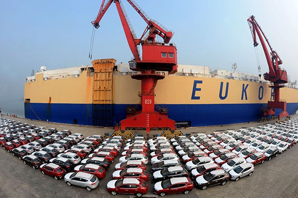 Rows of Chinese automobiles are lined up in Lianyungang Port, Jiangsu province, in January,2016 waiting to be shipped to Brazil. (Photo/China Daily)