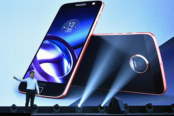 Chen Xudong, senior vice-president in charge of Lenovo's mobile business group, introduces the company's Moto Z series mobile phones in Beijing, on Sept 6, 2016. (Photo provided to China Daily)