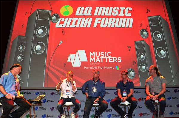 Andy Ng (second from left), general manager of QQ Music, speaks at the recent forum. (Photo provided to China Daily)