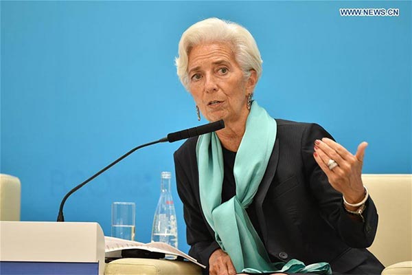 A Wensli silk scarf adds a distinctive color to the professional attire of Christine Lagarde, IMF president, at the B20 and G20 Hangzhou Summit. (Photo/Xinhua)