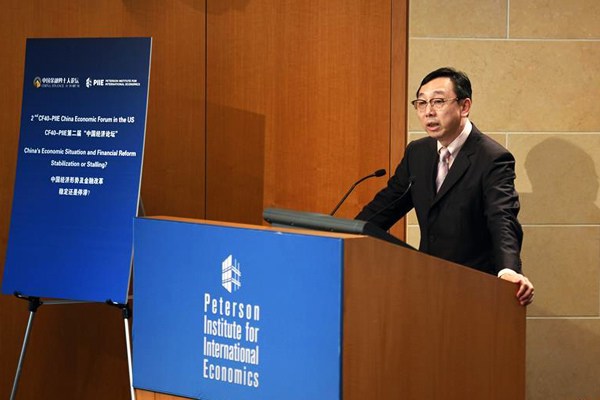 nternational Monetary Fund (IMF) deputy managing director Zhang Tao speaks at the Peterson Institute for International Economics in Washington D.C., Oct 5, 2016. (Photo/Xinhua)