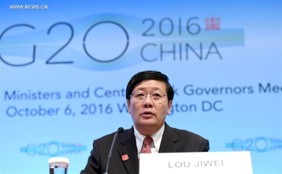  Chinese Finance Minister Lou Jiwei speaks at a press conference on G20 Finance Ministers and Central Bank Governors Meeting at the headquarters of International Monetary Fund(IMF) in Washington D.C., the United States, Oct. 7, 2016. (Photo: Xinhua/Yin Bogu)