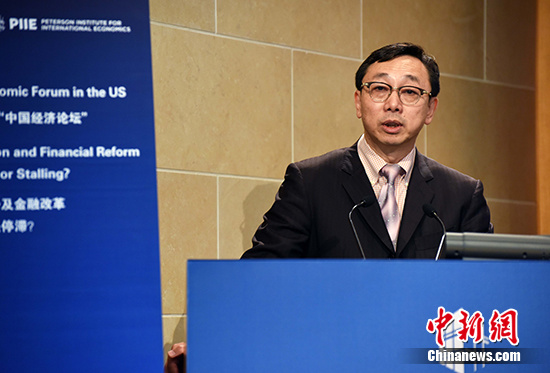 International Monetary Fund (IMF) deputy managing director Zhang Tao speaks at the Peterson Institute for International Economics in Washington D.C., Oct 5, 2016. (Photo:China News Service/Zhang Weiran)