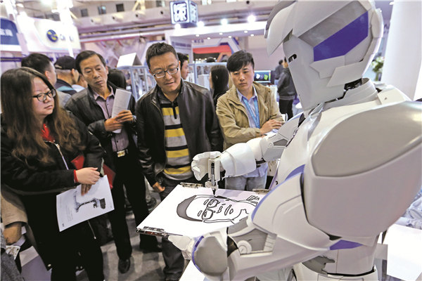 A robot draws a portrait at an industry expo held in Beijing on Friday. WANG ZHUANGFEI / CHINA DAILY