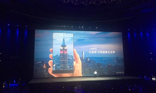 Xiaomi CEO Lei Jun introduces 6.4-inch phablet MIX with a 91.3 percent screen-to-body ratio at a press conference held in Beijing on Tuesday. (Photo: Zhang Ye/GT)