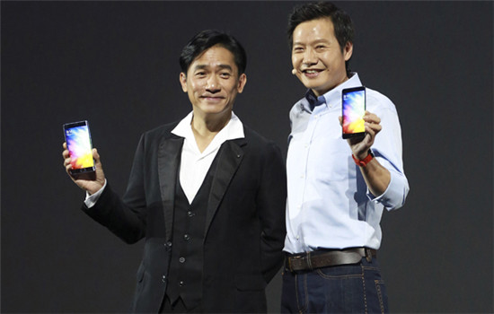 Actor Tony Leung Chiu Wai (left) and Lei Jun, founder and CEO of Xiaomi Corp, show Mi Note 2 smartphones with curved OLED screen in Beijing on Tuesday. (Photo by Feng Yongbin/China Daily)