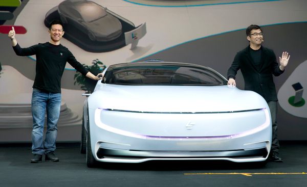 Jia Yueting (left), CEO of LeEco, introduces the company's first concept electric car LeSEE in April. PROVIDED TO CHINA DAILY