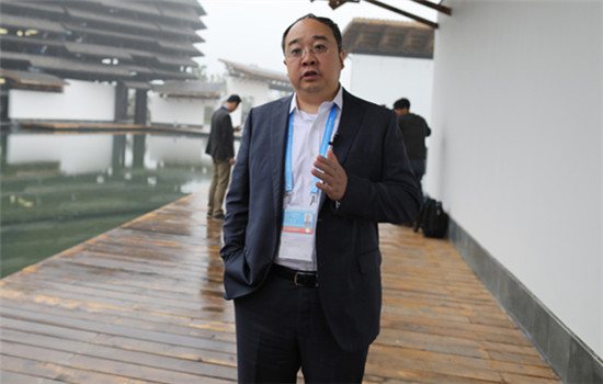 APUS CEO Li Tao gives interview in Wuzhen, East China's Zhejiang province, Nov 17, 2016. (Photo by Zhu Xingxin/chinadaily.com.cn)