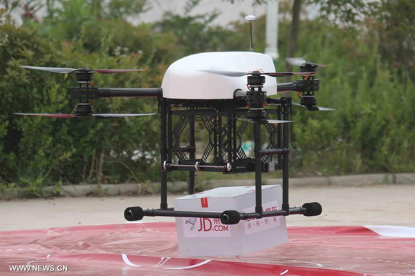 A drone owned by Chinese e-commerce site JD.com flies as it convey goods between distribution centers in Tiantong'an Village of Suqian City, east China's Jiangsu Province, June 8, 2016. (Photo/Xinhua)