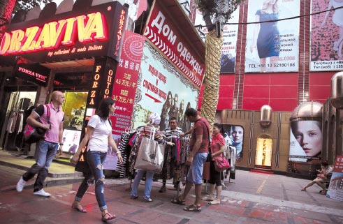 Yabao Road and its surroundings are packed with traders' stalls. It is the largest private wholesale clothing market in China aimed at customers from Russian-speaking countries. (Photo by Li Fei/China Daily)