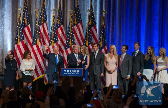 U.S. presumptive Republican Presidential nominee Donald Trump (4th, left) and his running mate Indiana Governor Mike Pence (3rd, left) are joined by their families on stage during a campaign event in New York, the United States, July 16, 2016. (Photo: Xinhua/Li Muzi)