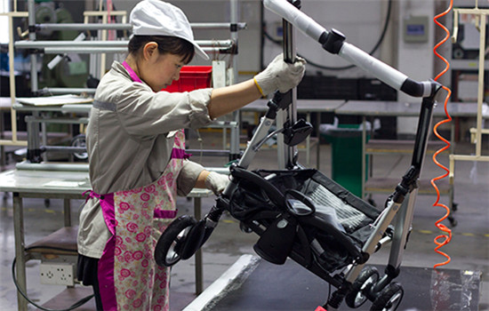 A worker assembles a stroller at a factory of Goodbaby Group in Kunshan, Jiangsu province. (Photo/China Daily)