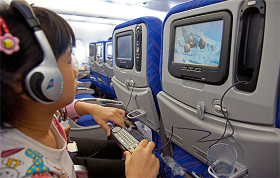 A girl watches a cartoon movie while on board an Airbus A380 of China Southern Airlines. (Photo/China Daily)