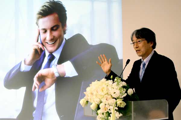 Shigeki Inoue, senior MD and COO of Seiko Epson's wearables division, speaks at the launch of three new series of smartwatches in the Chinese market in December. (Photo by Zhang Wei/China Daily)