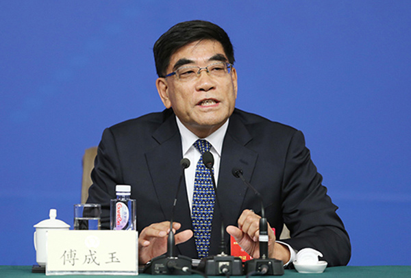 Fu Chengyu, former chairman of Sinopec Group and a member of the Chinese People's Political Consultative Conference (CPPCC) National Committee, at a briefing on Mar 11, 2016. (Photo/China Daily)