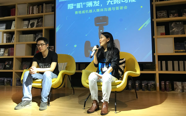 Pu Li (left) , vice president of Ninebot Inc, and Sarah Zhang, senior director and head of Robotics Business Operations of Ninebot, speak to media during a press conference held in January 19, 2017 in Beijing. Liu Zheng/chinadaily.com.cn