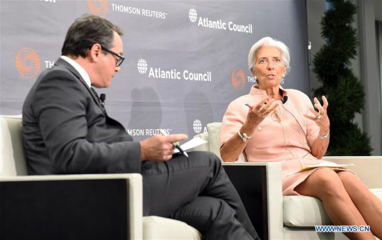 International Monetary Fund (IMF) Managing Director Christine Lagarde (R) speaks on 'The Power of Transparency to Increase Economic Resilience' at Atlantic Council in Washington D.C., the United States, Feb. 8, 2017. (Xinhua/Bao Dandan)