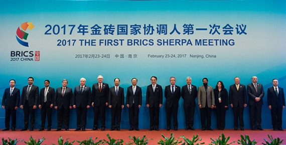 State Councilor Yang Jiechi (eighth from left) and representatives of BRICS countries pose on Thursday at the opening ceremony of the year's first BRICS Sherpa meeting in Nanjing, Jiangsu province. Yang urged BRICS nations to work together to raise the voices of developing countries in global affairs. (Xinhua/Li Xiang)