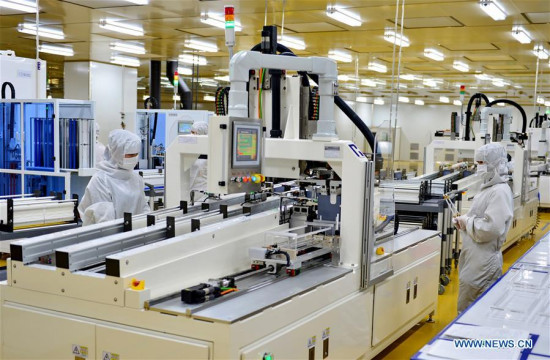 Workers work in a factory of Jinglong Industry and Commerce Group in Xingtai, north China's Hebei Province, Jan. 25, 2017. (Xinhua file photo/Mu Yu)
