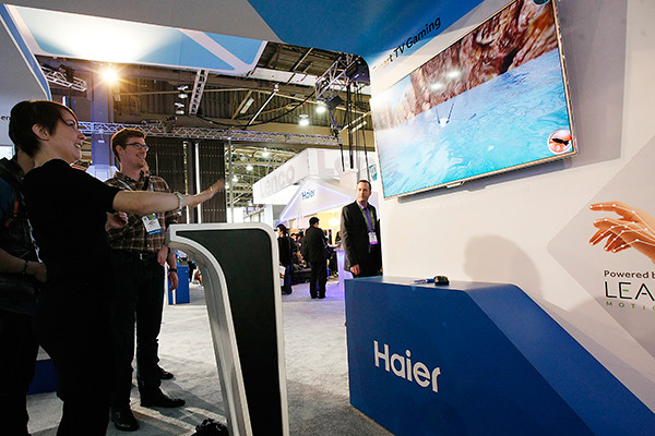 Qingdao Haier Co Ltd displays its TV product at the CES in Las Vegas, Nevada, United States. (Photo/Xinhua)