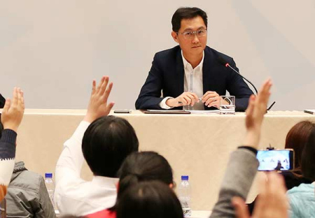 Ma Huateng, chairman of Tencent and deputy of the National People's Congress, answers reporters' questions ahead of the fifth plenary session of the 12th NPC in Beijing on Friday. (Photo/CHINA DAILY)