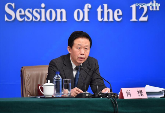 Chinese Minister of Finance Xiao Jie answers questions on reform of fiscal and taxation system and financial work at a press conference for the fifth session of the 12th National People's Congress in Beijing, capital of China, March 7, 2017. (Xinhua/Li Xin)