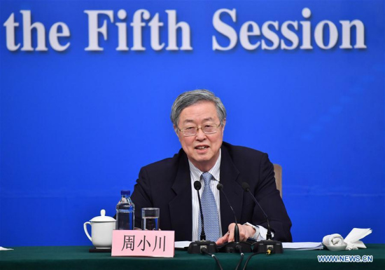 Zhou Xiaochuan, governor of the People's Bank of China (PBC), answers questions at a press conference on financial reform and development for the fifth session of the 12th NPC in Beijing, capital of China, March 10, 2017. (Xinhua/Li Xin)