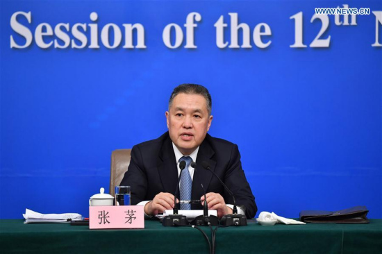 Zhang Mao, head of the State Administration for Industry and Commerce, answers questions at a press conference on deepening reforms to commerce affairs administration for the fifth session of the 12th National People's Congress in Beijing, capital of China, March 10, 2017. (Xinhua/Li Xin)