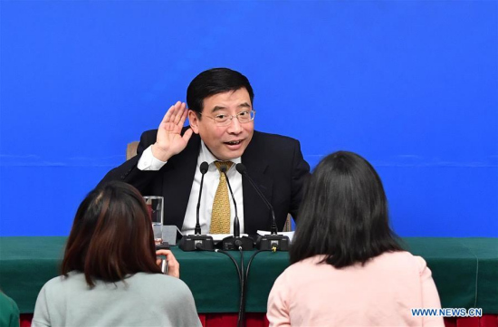 Miao Wei, Minister of Industry and Information Technology, communicates with journalists after a press conference on Made in China 2025 plan for the fifth session of the 12th National People's Congress in Beijing, capital of China, March 11, 2017. (Xinhua/Li Xin)